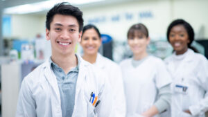 Pharmacy professionals standing together in the pharmacy