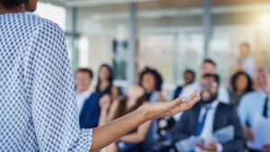 Person presenting to crowd