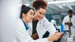 Two pharmacy professionals working together