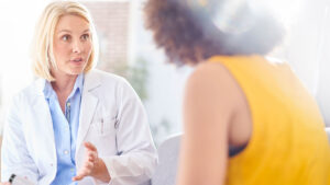 Pharmacist talking with patient
