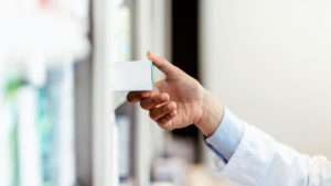 Pharmacy team member pulling box off shelf