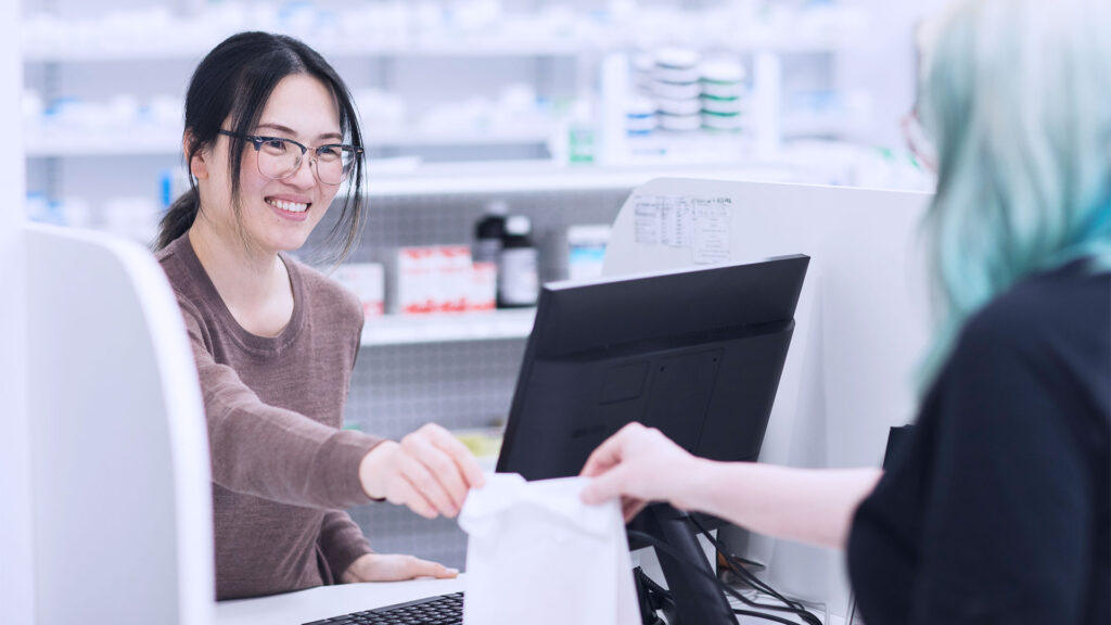 Pharmacist Anne Oommen (left) and patient Liz Ferguson (right)